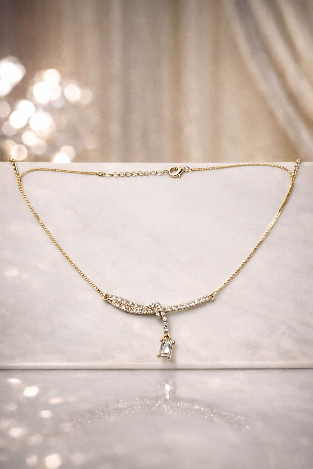 Dainty Crystal Knot Pendant Necklace – Gold Finish